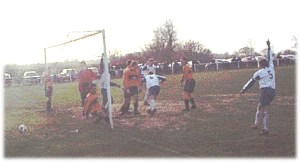 John Everritt (center) wheels away after equalising at White Notley.